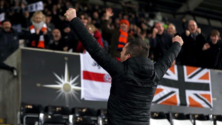 Nathan Jones celebrates with the Luton fans after beating Swansea