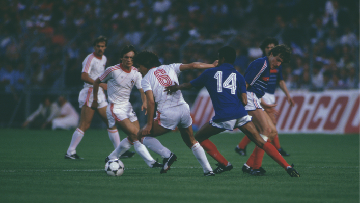 France midfielder Jean Tigana (14) battles with Portugal's midfielders in Marseille