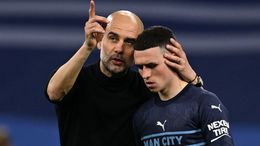 Pep Guardiola consoles Phil Foden after Manchester City's dramatic exit to Real Madrid