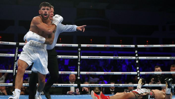 Joe Cordina celebrates after flooring Kenichi Ogawa