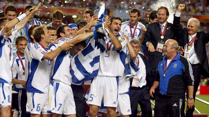 Greece lift the Euro 2004 trophy after defeating Portugal in Lisbon