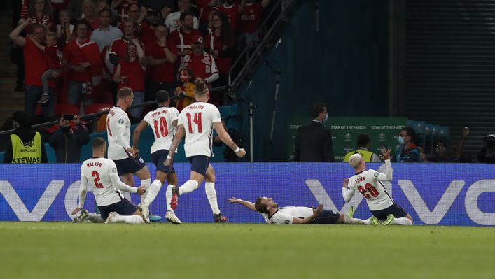 England players engulf Harry Kane after he put England 2-1 up in extra-time