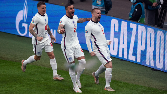 Kieran Trippier (left) and Kyle Walker (centre) join Luke Shaw's celebrations