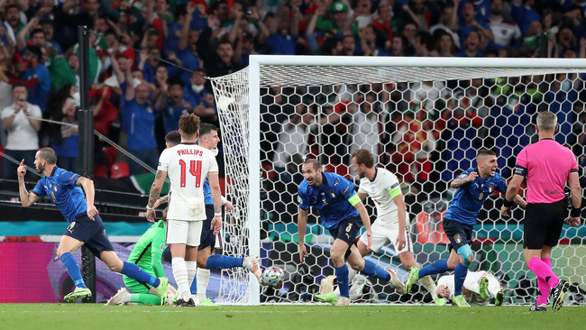 Italy centre-back Leonardo Bonucci turns away to celebrate after levelling for the Azzurri