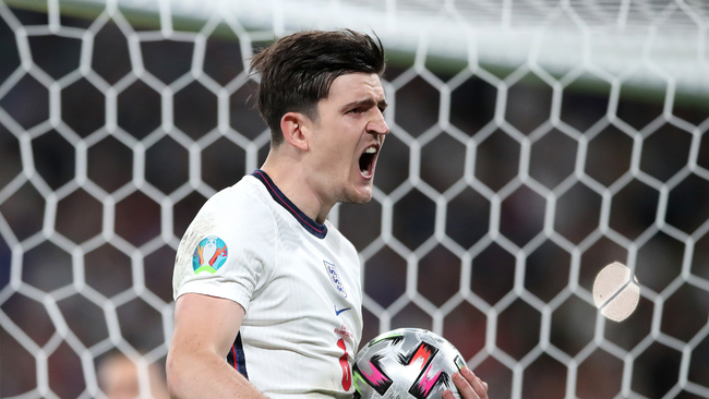 Harry Maguire celebrates converting his penalty with aplomb...but it wasn't to be