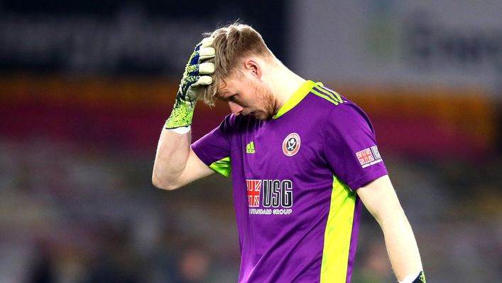 A dejected Aaron Ramsdale trudges off at full-time following Sheffield United's relegation