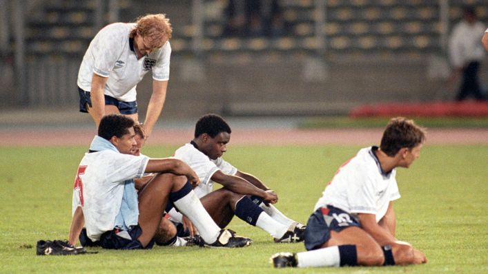 Paul Parker (centre) sits with his team-mates after England's heartbreaking exit at Italia 90