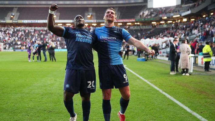 Adebayo Akinfenwa and Sam Vokes celebrate reaching the play-off final after knocking out MK Dons