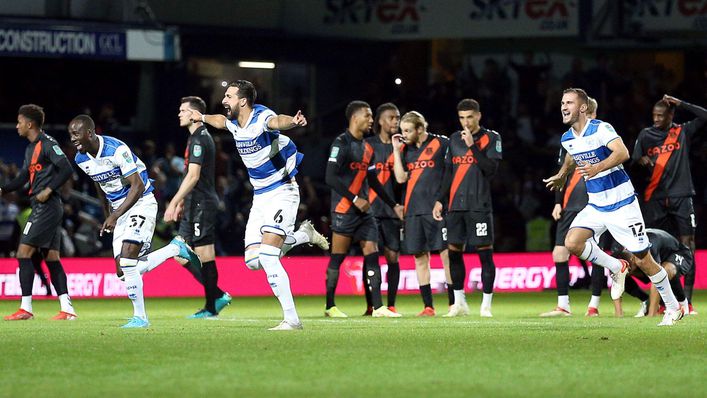 QPR players celebrate their winning penalty against Everton