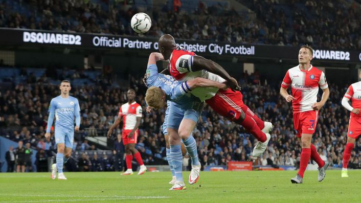 The captain's lead by example as Adebayo Akinfenwa battles with Kevin De Bruyne