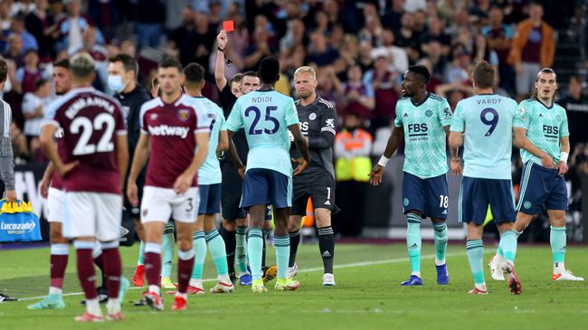 Leicester players protest as Ayoze Perez is shown a red card following a VAR review