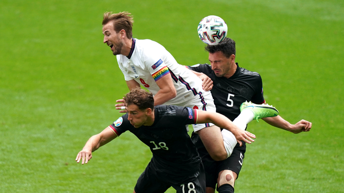 Harry Kane takes the aerial route up against Germany's Mats Hummels and Leon Goretzka
