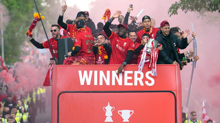 Liverpool's players and staff were greeted by thousands of fans during their open-top bus parade